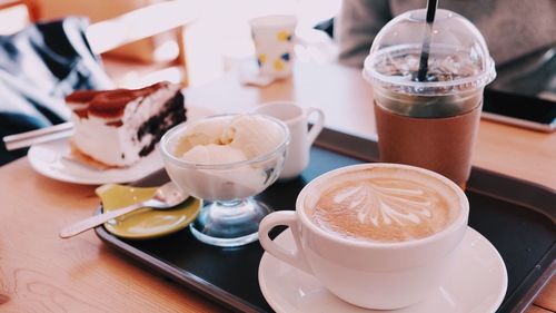 Close-up of cappuccino served on table