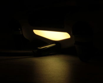 Close-up of illuminated lamp in the dark