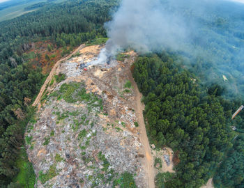 Aerial view of smoke emitting from mountain