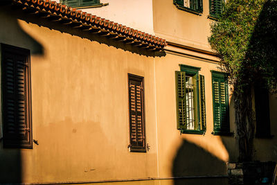 Shadow of house on wall by building