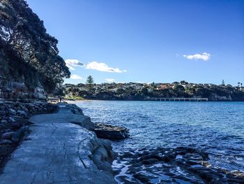 Scenic view of sea against blue sky