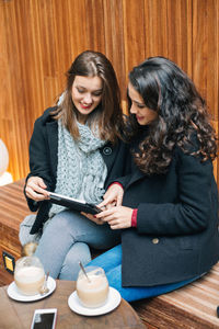 Young woman using smart phone