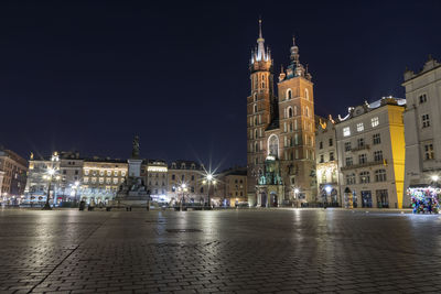 Illuminated buildings in city at night