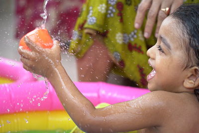 Portrait of shirtless boy in water