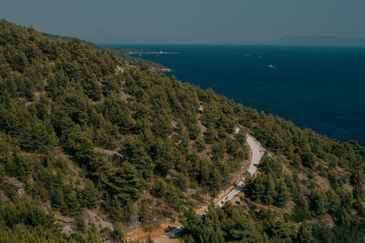 High angle view of sea and trees against sky