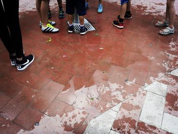 Low section of people standing on floor