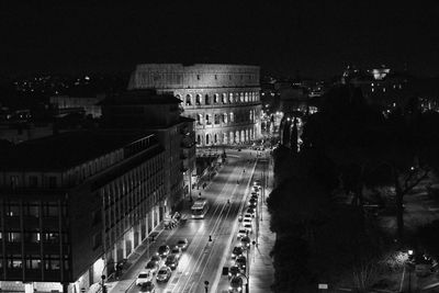 High angle view of city lit up at night