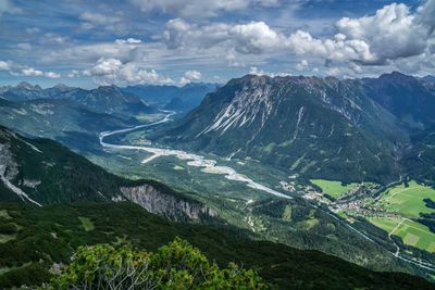 Scenic view of landscape and mountains against sky