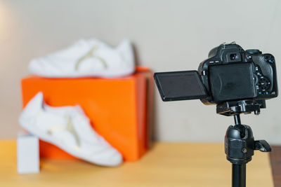 Close-up of camera against white background