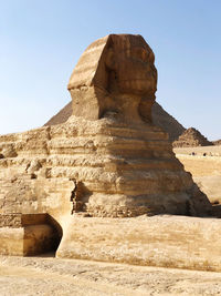 Low angle view of rock formations against clear sky