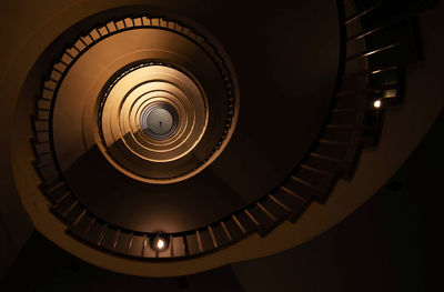 Spiral staircase in a tall multi-floor house, in the form of a golden ratio, architecture, concept