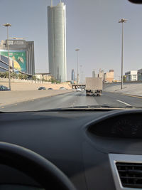 City seen through car windshield