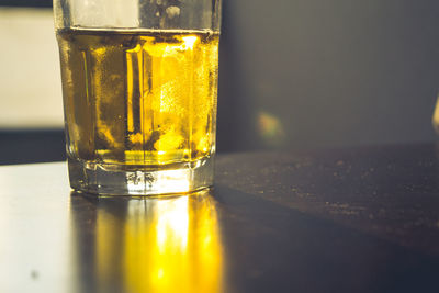 Close-up of beer in glass on table