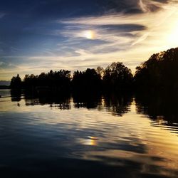 Scenic view of lake at sunset