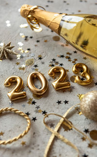 Cropped hand of woman holding christmas decorations