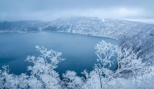 Aerial view of frozen lake against sky