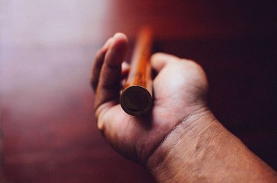 Cropped hand of woman holding cigarette