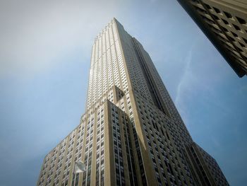 Low angle view of skyscraper against sky