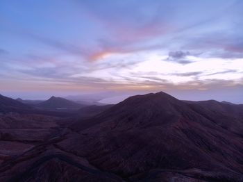 Scenic view of mountains against sky during sunset