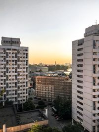 High angle view of buildings against sky during sunset