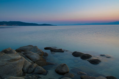 Scenic view of sea against sky at sunset