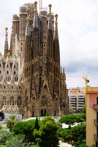 Buildings in city against sky