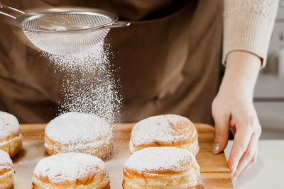 Woman cooking donuts