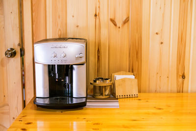 Espresso coffee machine. on woden table.