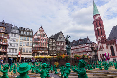 Panoramic view of people in city against sky