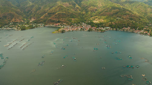 Aerial view of fish farm with cages for fish and shrimp on the lake taal, philippines, luzon. 