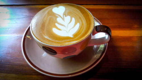 Close-up of cappuccino on table