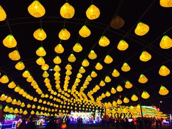 Illuminated lanterns hanging at night