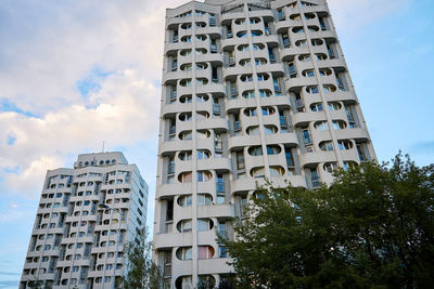 Low angle view of modern buildings against sky