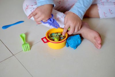 High angle view of boy playing with toy