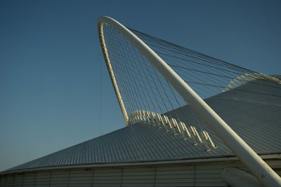 Low angle view of modern building against blue sky