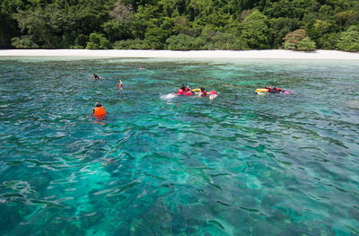 People swimming in sea