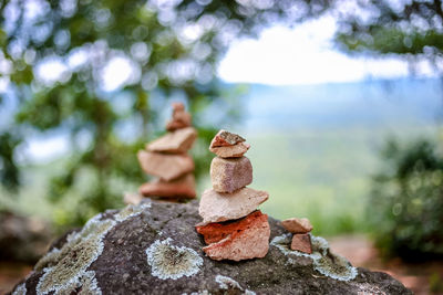 Close-up of stones stacked on rock