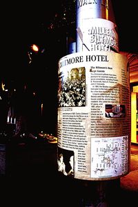 Close-up of illuminated text on wall