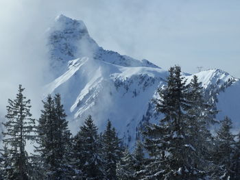 Scenic view of snow covered mountain against sky