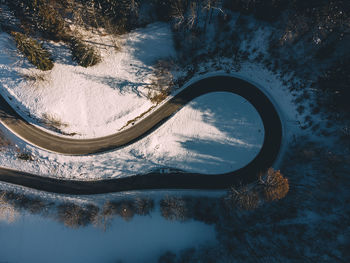 High angle view of reflection in lake during winter