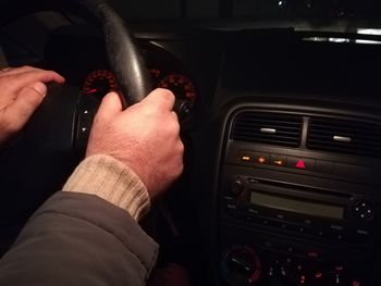 Close-up of hand holding car