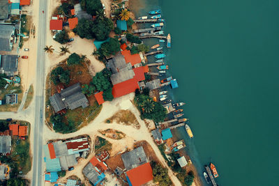 Aerial view of buildings and sea in city