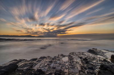 Scenic view of sea against sky during sunset