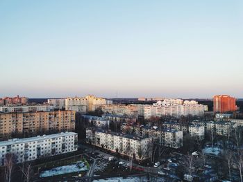 High angle view of buildings against clear sky