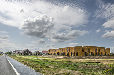 Dutch suburb under a dramatic sky