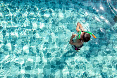 High angle view of man swimming in pool