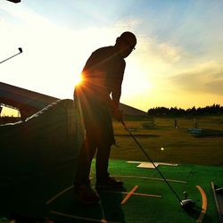 Silhouette of people at sunset
