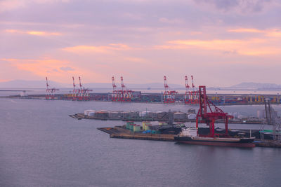 Commercial dock against sky during sunset