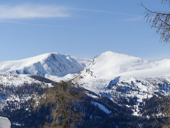 Scenic view of snowcapped mountains against sky