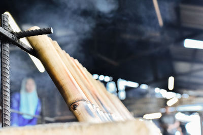 Close-up of man holding wood